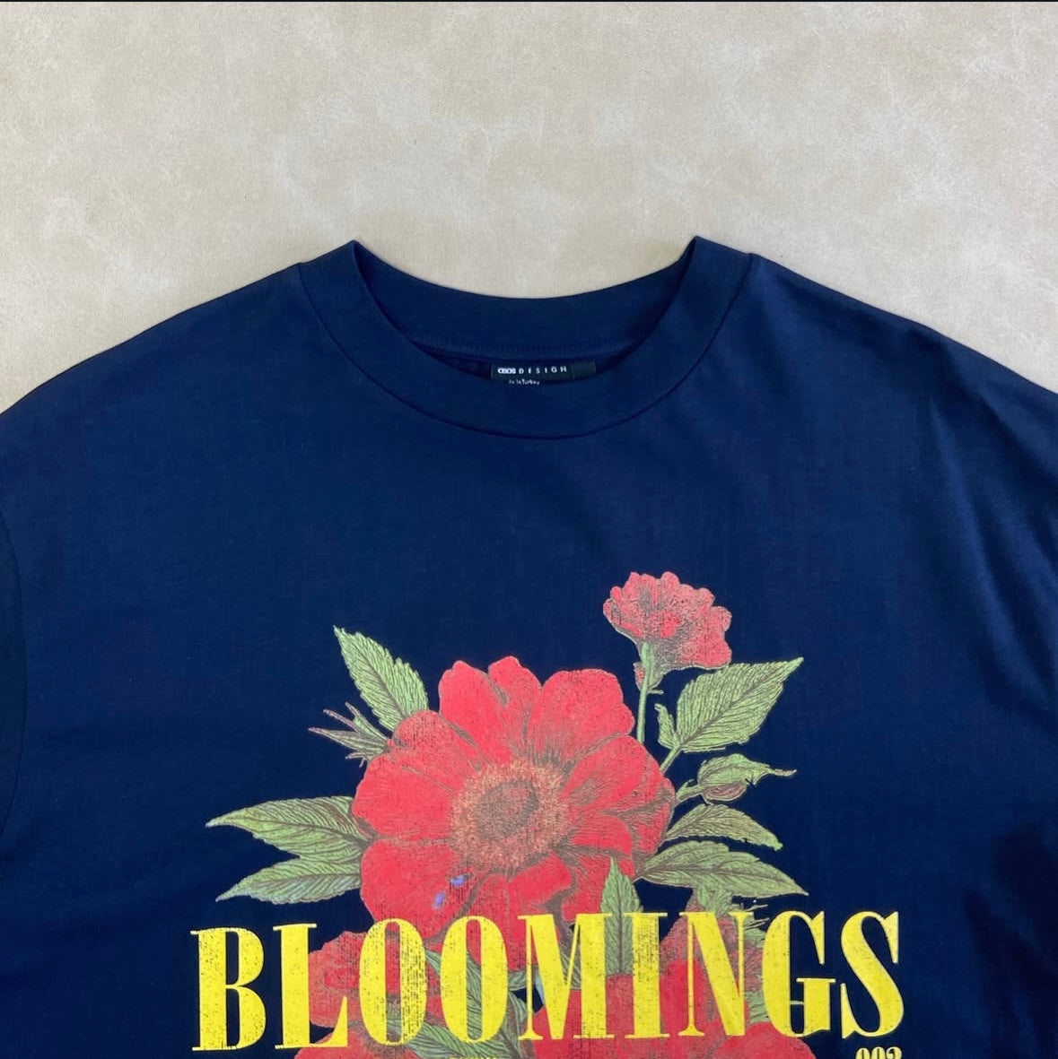 ASOS DESIGN oversized t-shirt with blooming floral graphic in navy