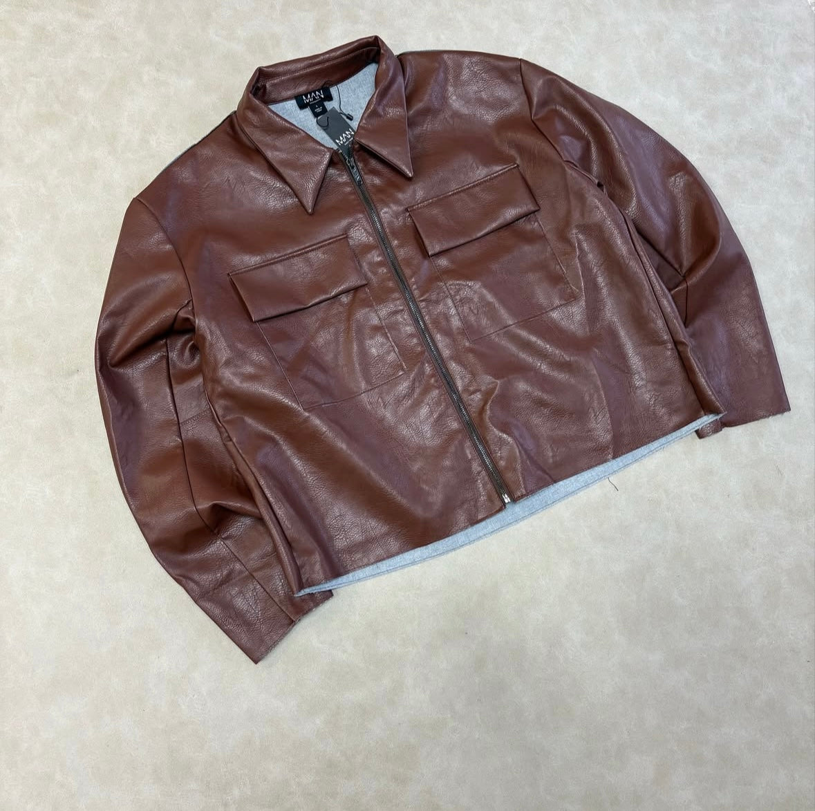 Boxy Collared PU Harrington Jacket With
Raw Edge In Brown
